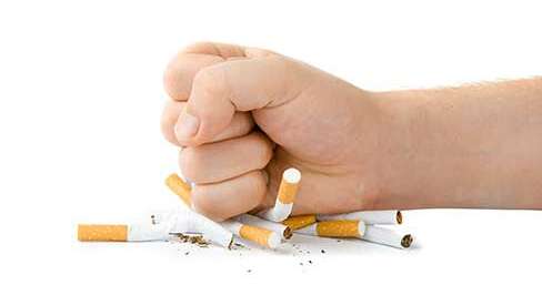 HAND CRUSHES CIGARETTES 